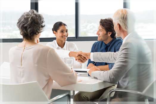 mature couple consulting with insurance agent